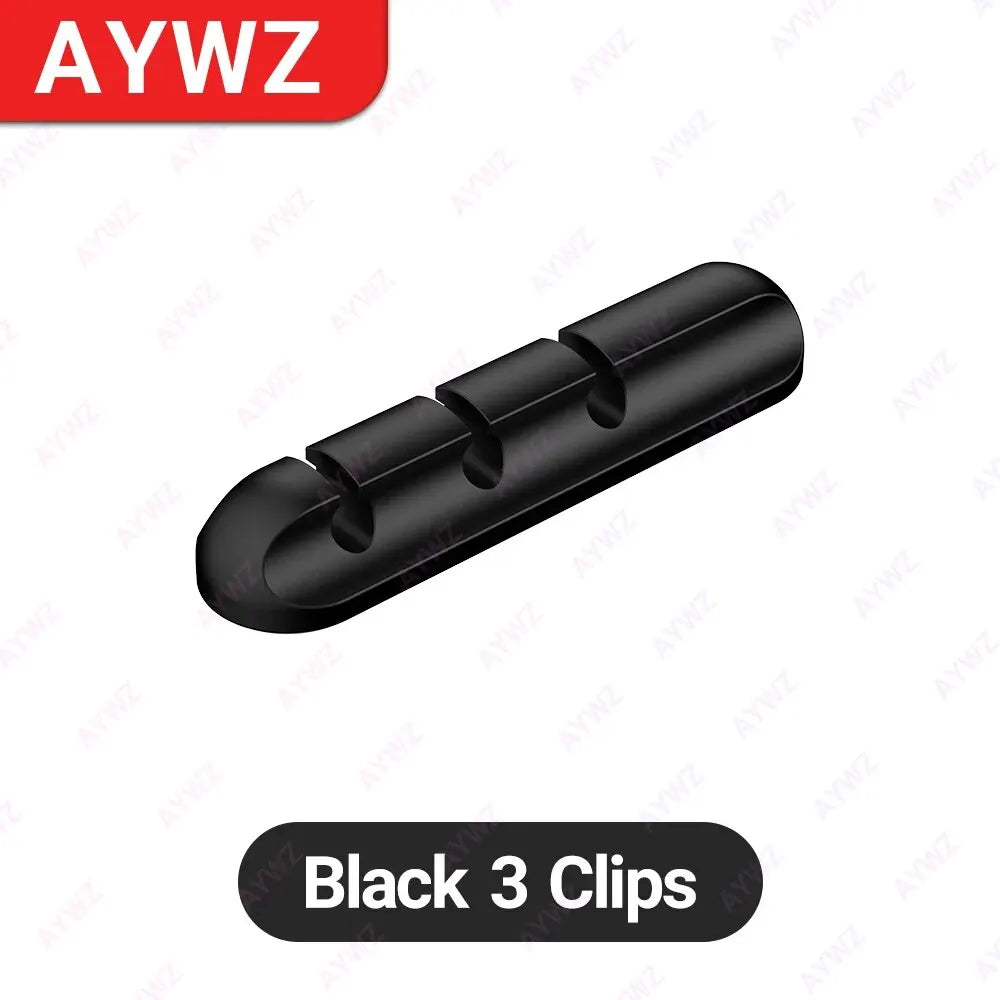Black adhesive cable holder clip bar with three round openings for charging cables