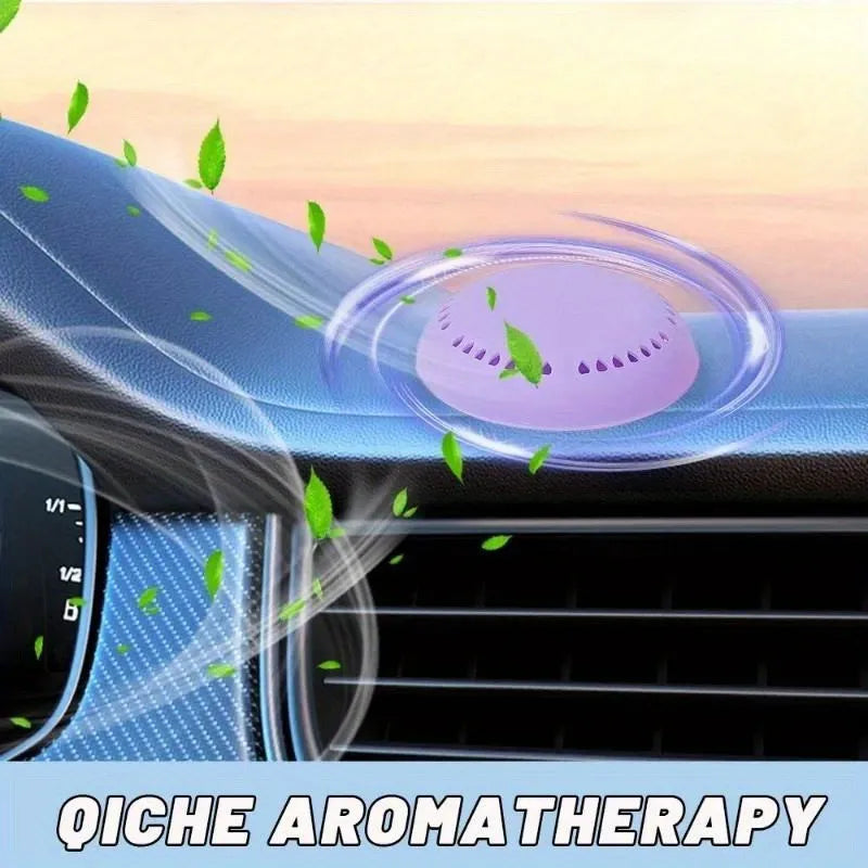 Purple round aromatherapy deodorizing tablet in a car vent holder