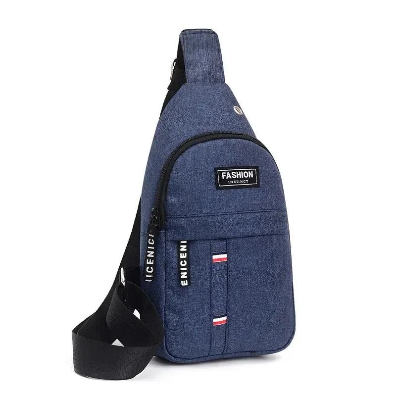 Blue denim waterproof fanny pack with front zip pocket, logo patch, and adjustable strap