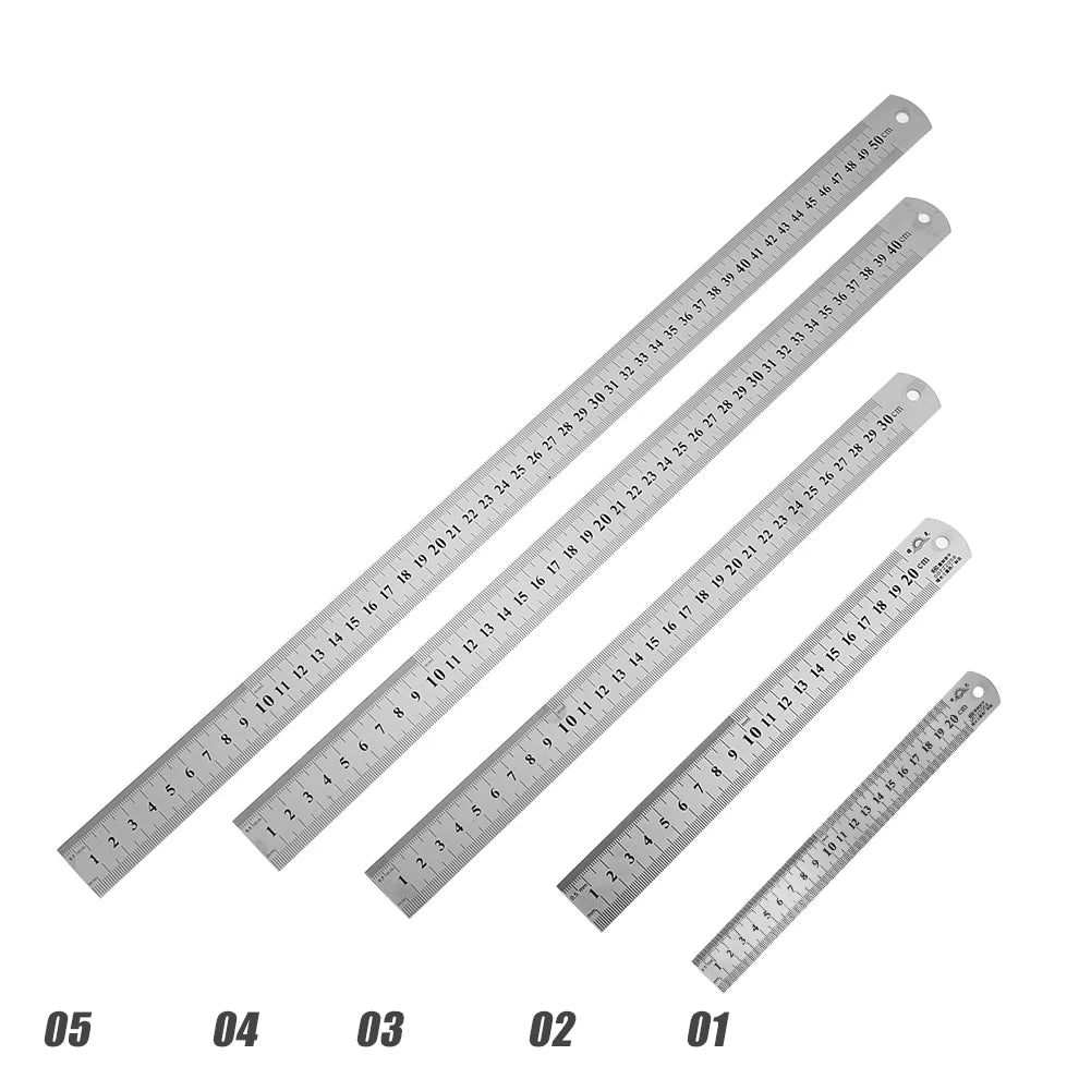 Five stainless steel straight rulers with engraved measurement scales