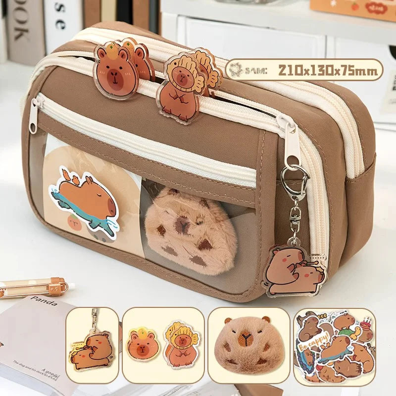 Brown and beige fabric pencil case with zipper, clear window, and bear plush charm