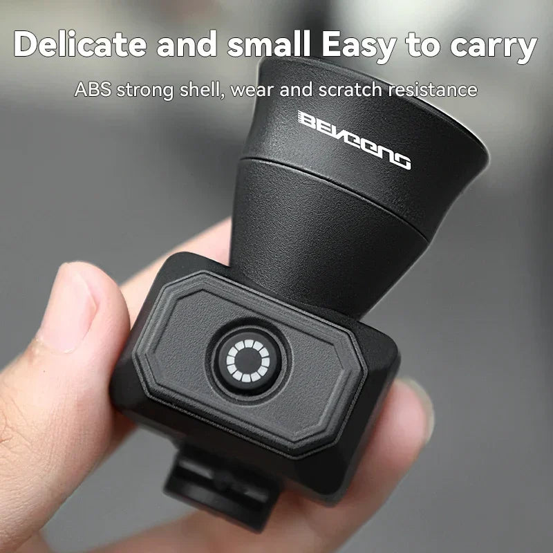 Black compact bicycle electronic horn held in hand, ABS shell and speaker