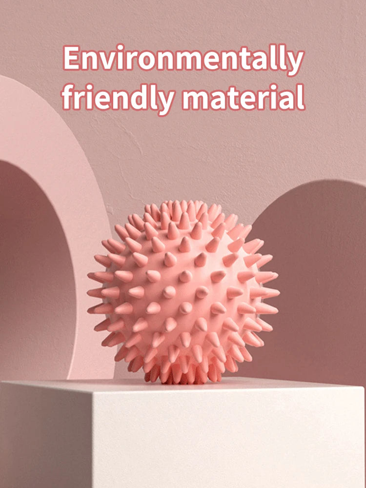 Pink spiked massage fascia ball for muscle relaxation and fascia release