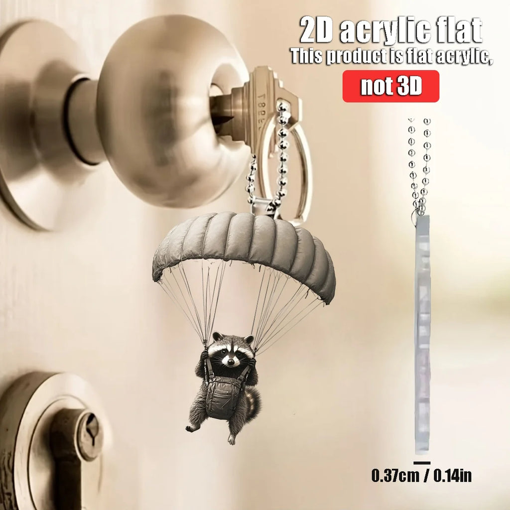 Parachute animal keychain pendant hanging from chain with small backpack detail