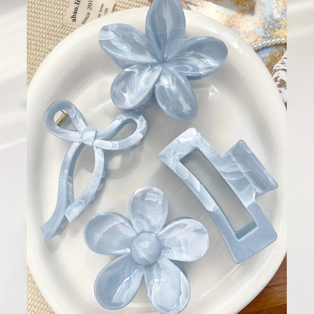 Light blue daisy flower hair claw with ribbon bow and rectangular claw clip
