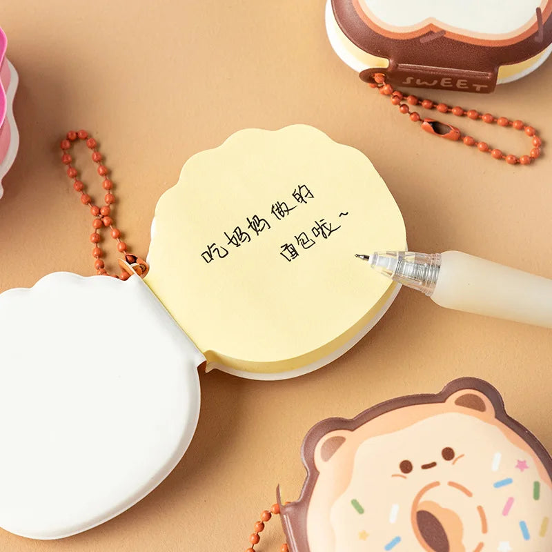 Heart and bear-shaped sticky memo notes with colorful bead necklaces