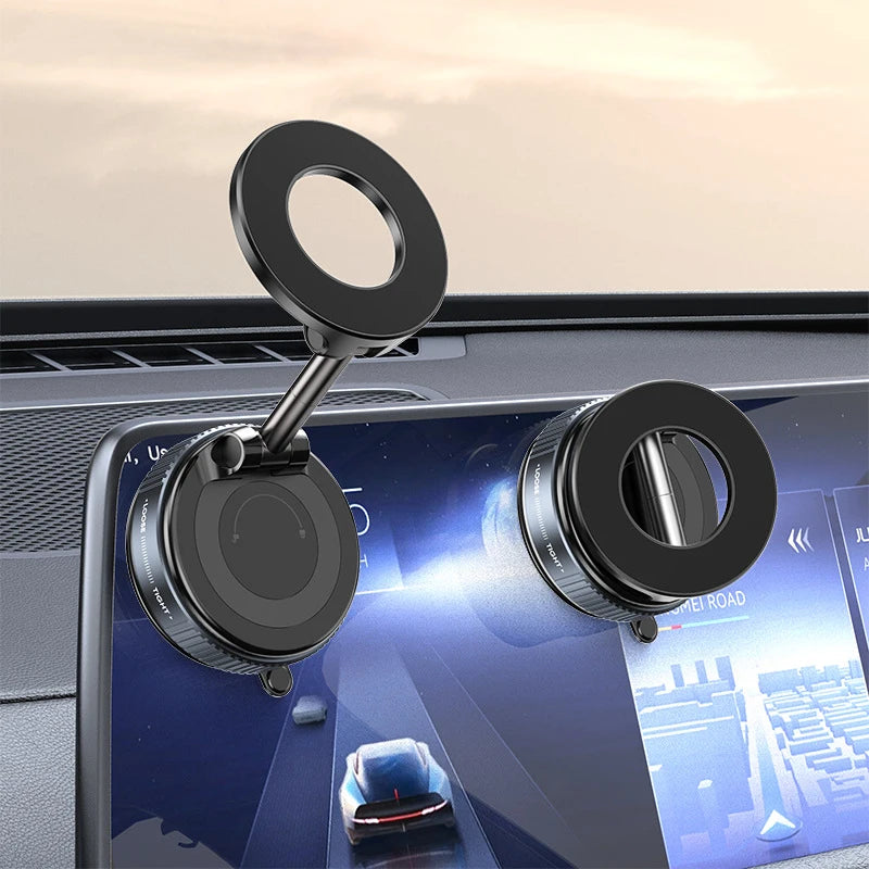Black magnetic car phone holder with suction mount attached on dashboard