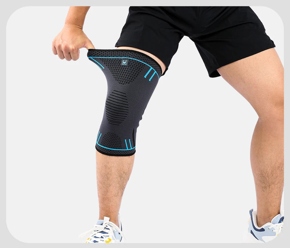 Black knee brace sleeve with blue stripes fitted around the kneecap