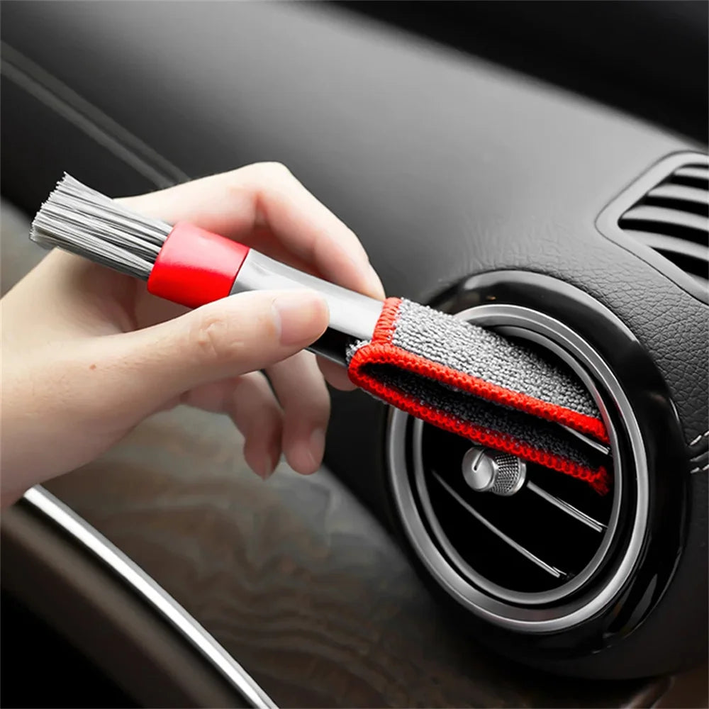 Car air vent cleaning tool with red-and-gray brush head and scrubbing pad