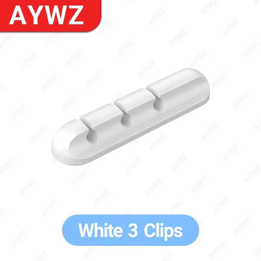 White adhesive cable holder clip bar with three round openings for charging cables