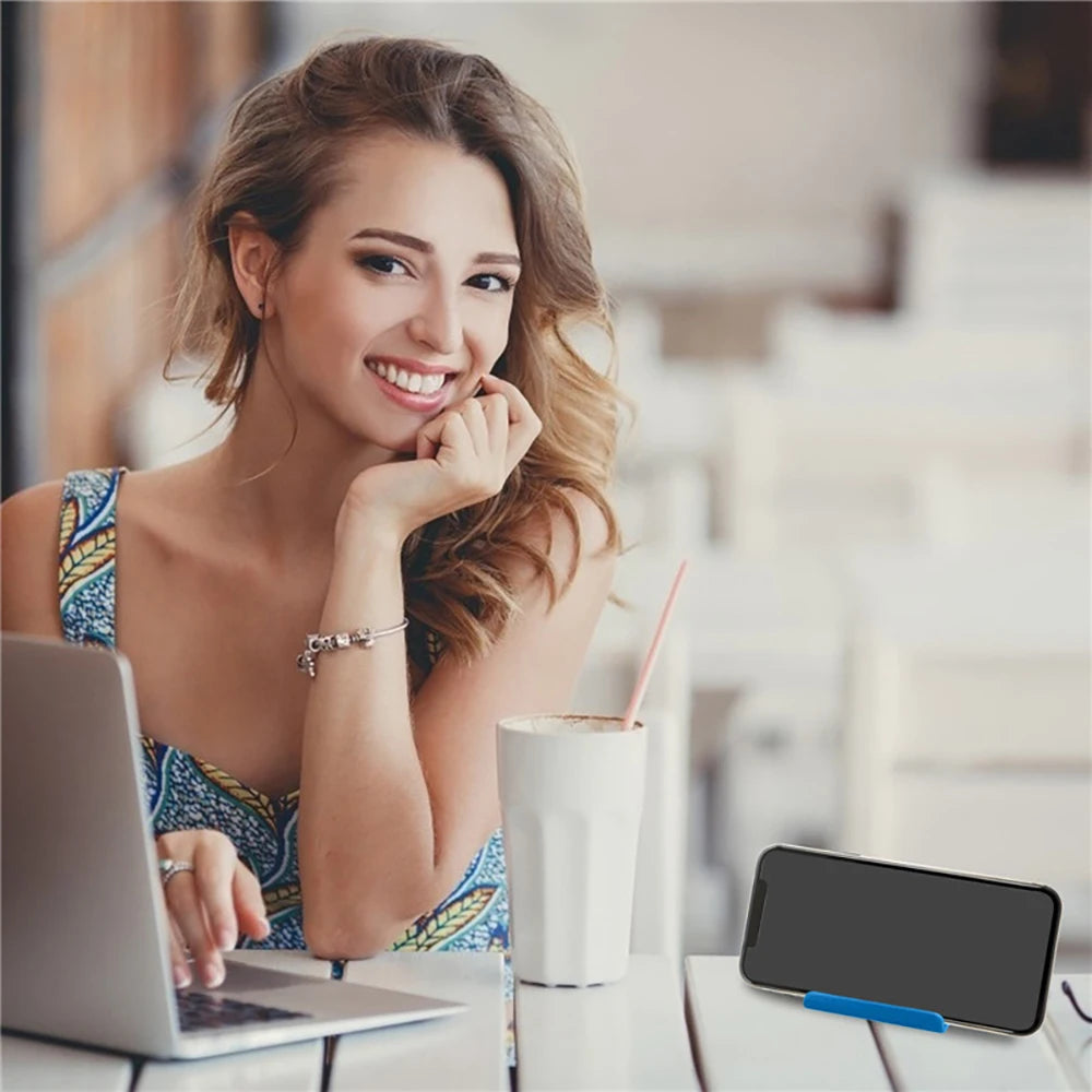 Smartphone on blue plastic phone holder stand for hands-free viewing