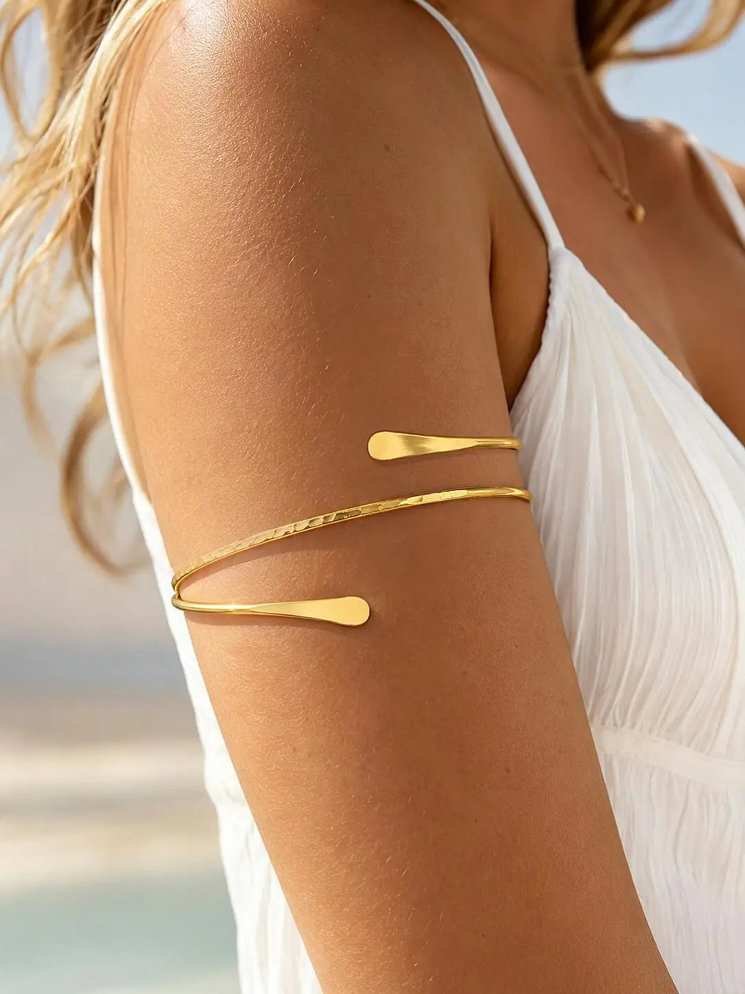 Gold-plated minimalist open arm cuff bracelet with adjustable bar design