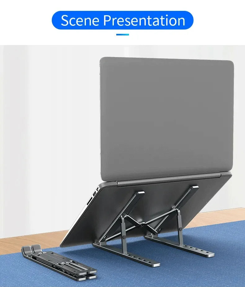 Adjustable laptop stand with gray top and black support arms, foldable base.