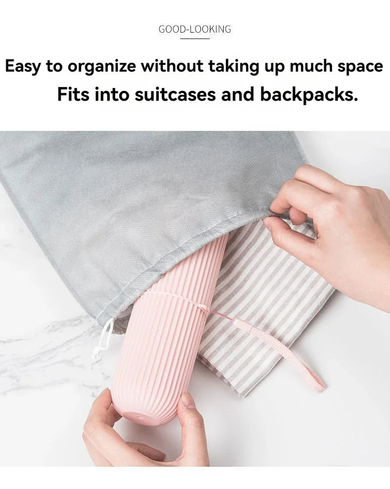 Pink ribbed toothbrush holder case opened with strap; light gray case shown