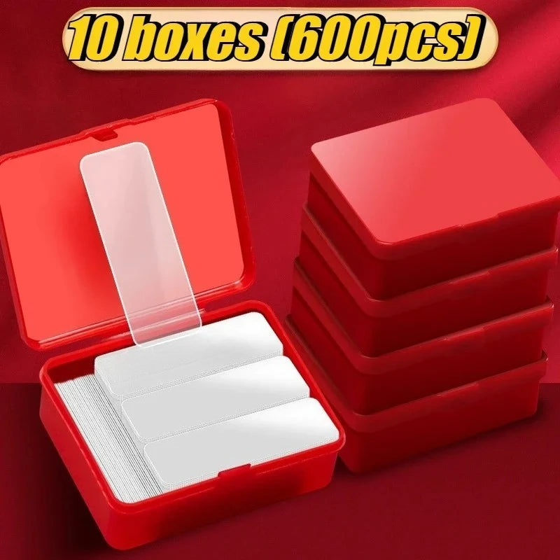 Double-sided adhesive mounting tape strips in multiple red organizer boxes