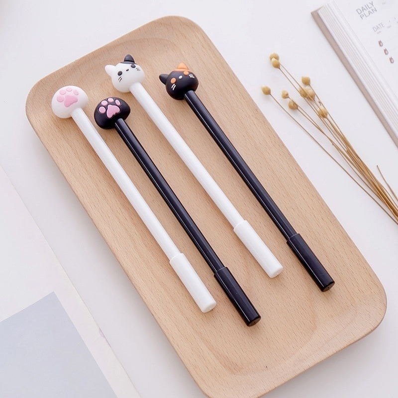 Kawaii cat gel pen set (10-pack) on a wooden tray: white and black cat claw pens