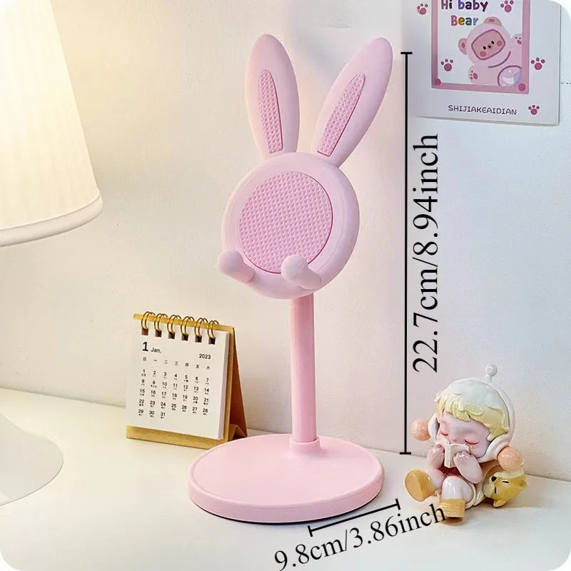 Pink rabbit desktop phone stand with bunny ears and round mesh speaker-like pad
