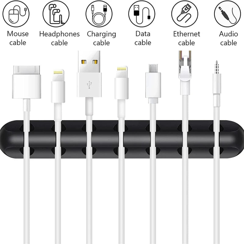 White cable organizer snap clips with several cables routed through the holders