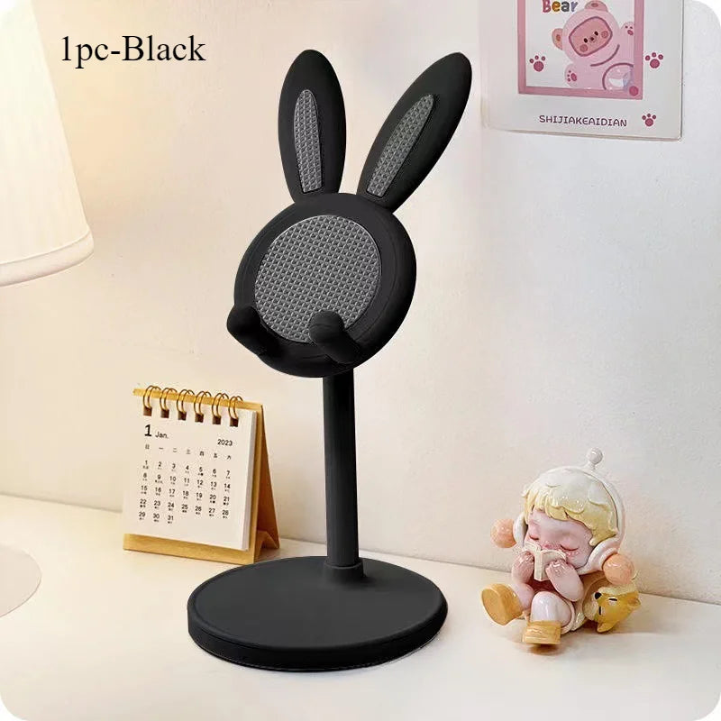 Black rabbit-shaped desktop phone stand with textured grip on round base