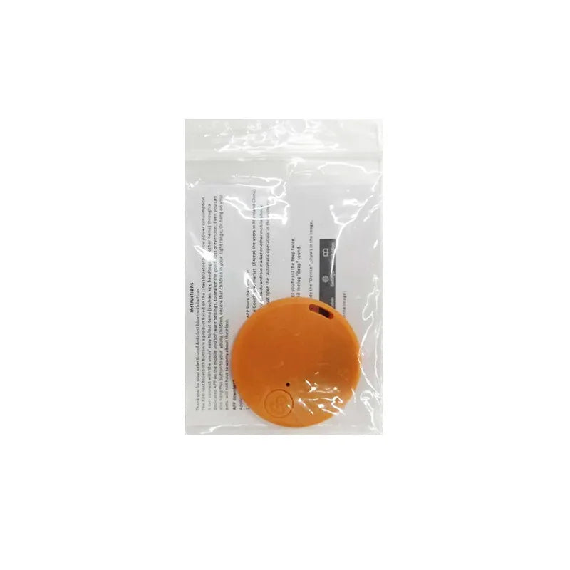 Orange Bluetooth anti-lost tracker key fob in clear plastic pouch