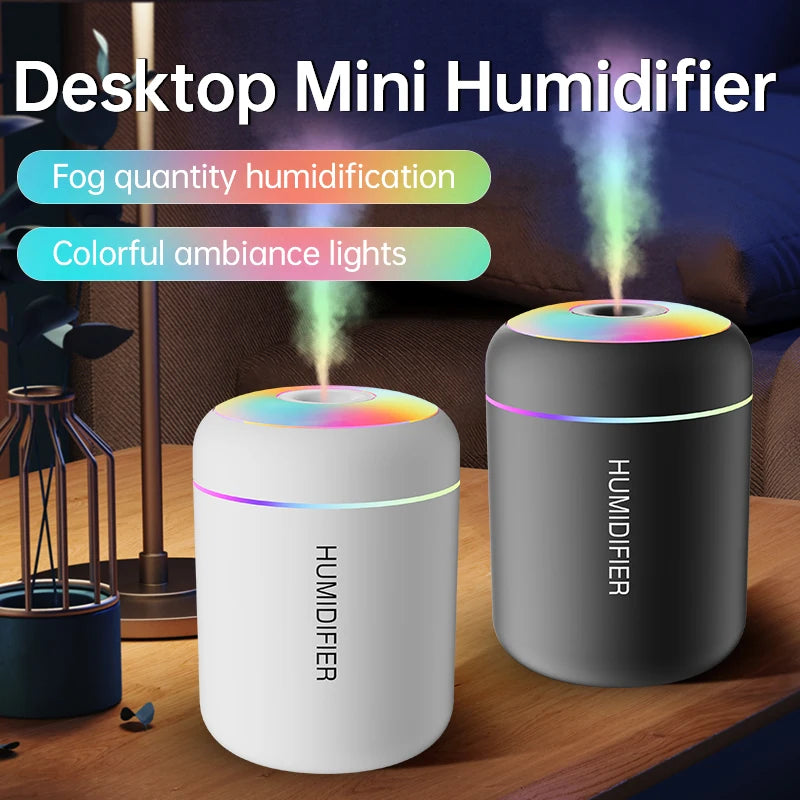 Desktop mini humidifier in white and black with rainbow LED tops and mist