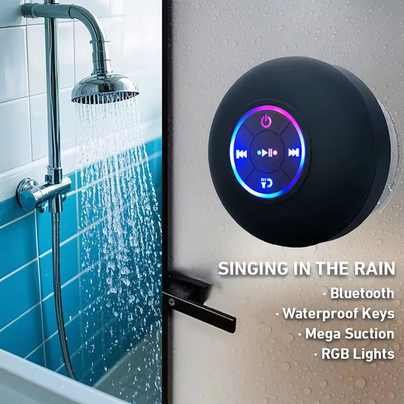 Black portable Bluetooth speaker with glowing RGB ring and control icons, mounted on a wet wall