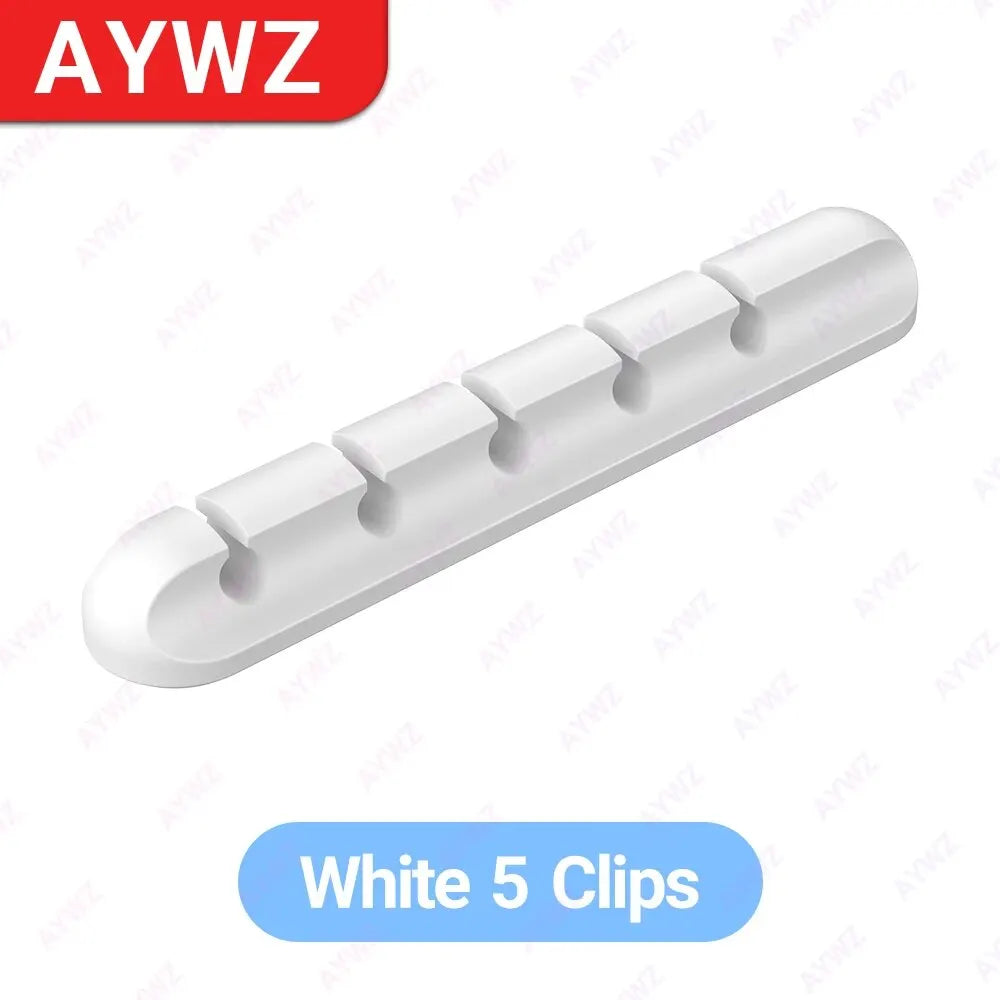 White adhesive cable holder clip bar with five round openings for USB charging cords