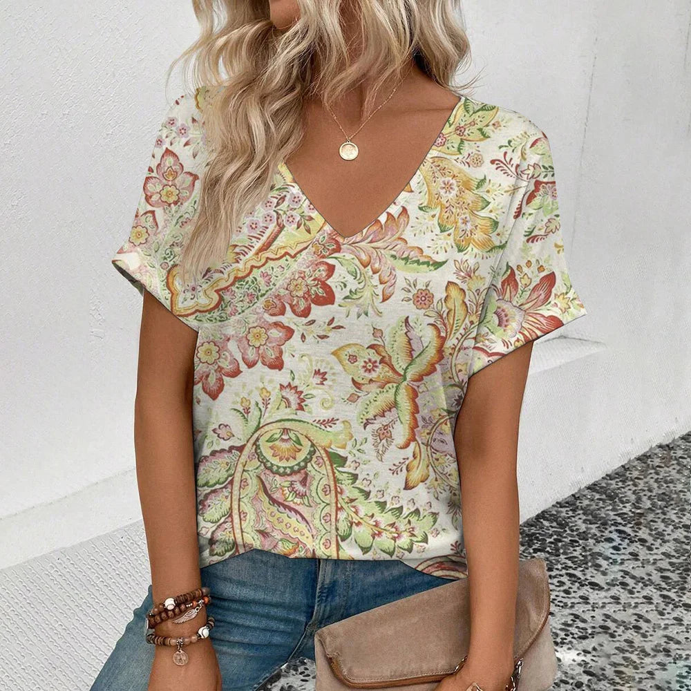 Women's plus-size V-neck T-shirt, cream with green and pink paisley floral print.