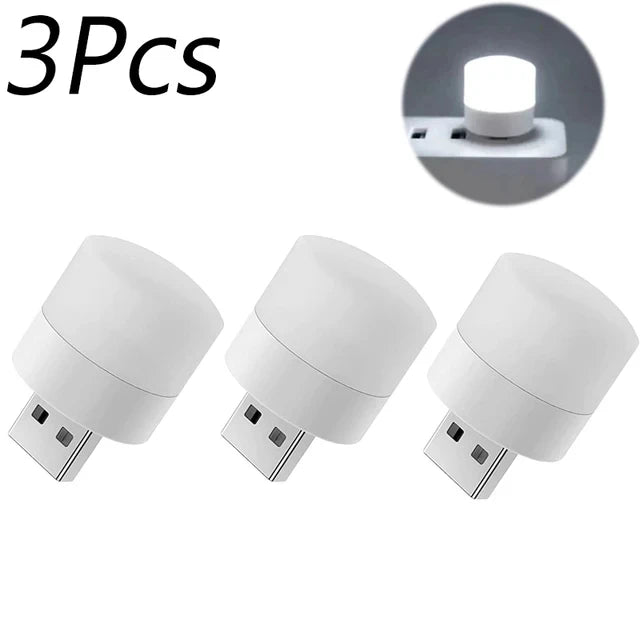 Set of three white USB mini night light bulbs with glowing top on base