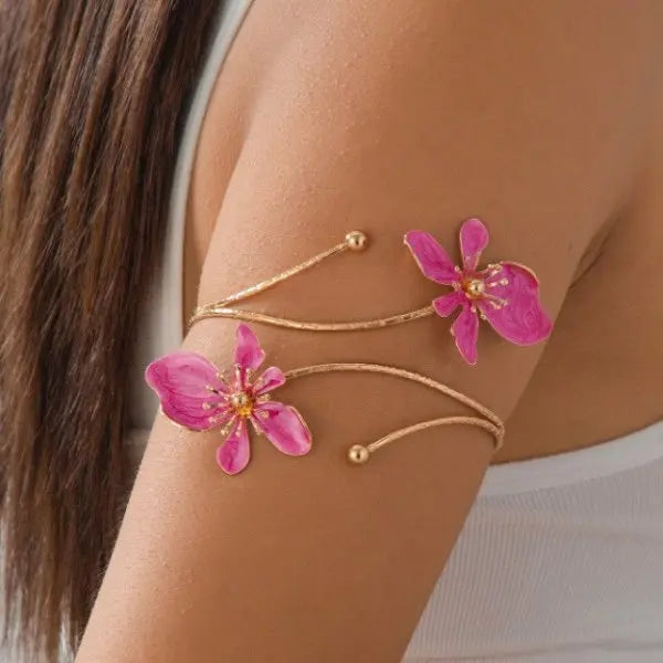 Floral open cuff armlet with magenta-pink flower charms and adjustable chain bracelet