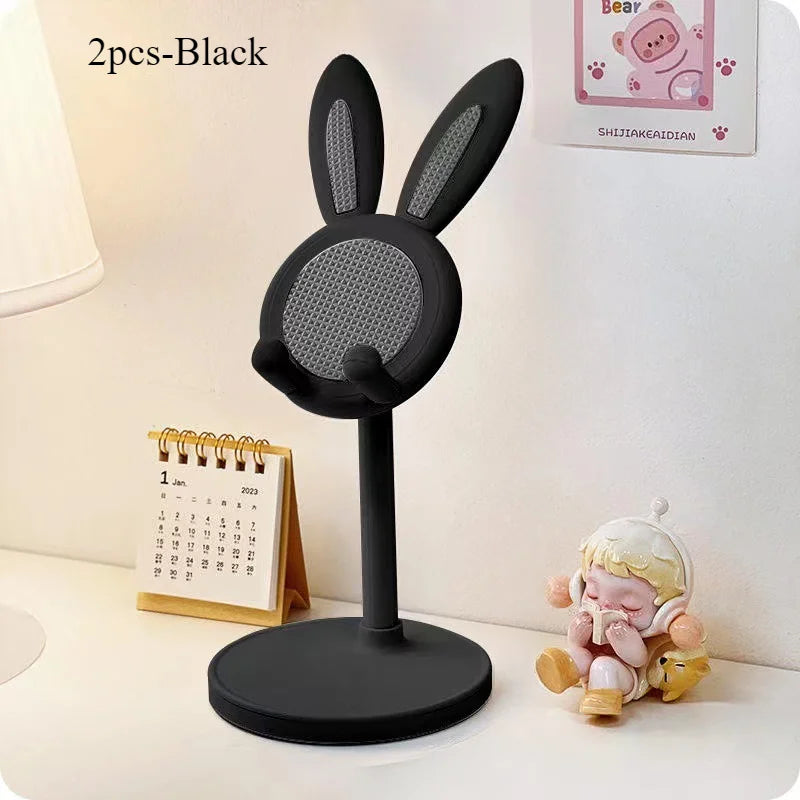 Black rabbit-shaped desktop phone stand with textured holder and round base