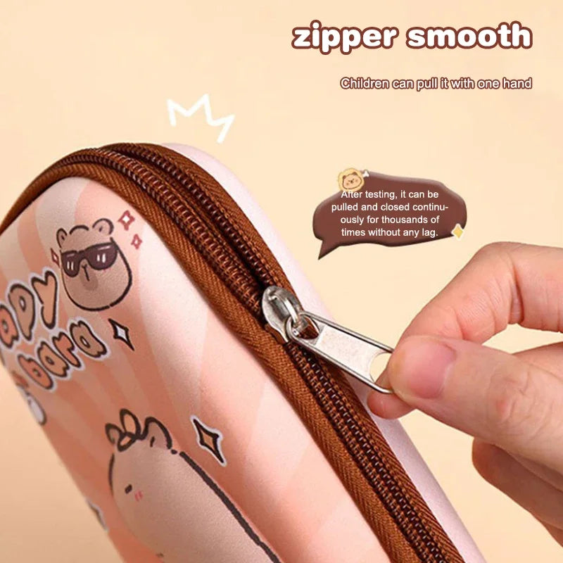 Pink capybara pencil case close-up, showing brown zipper and metal pull tab.