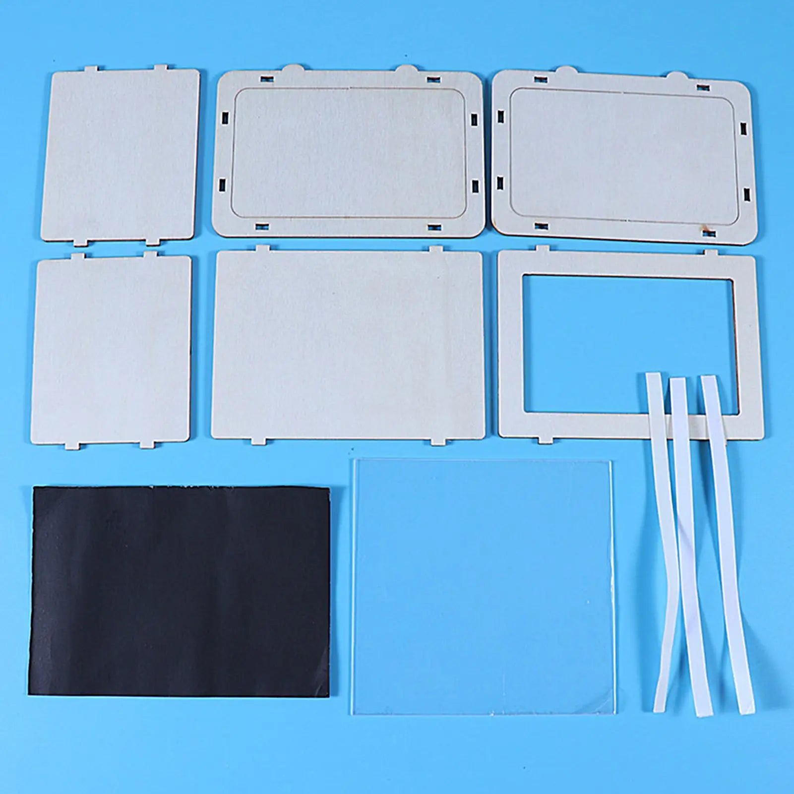 DIY 3D hologram projector parts kit: multiple flat wooden panels and accessories