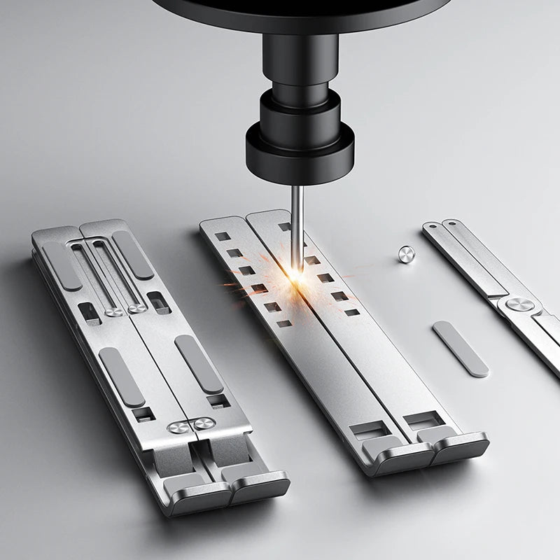 Silver foldable laptop stand with underside slots and click-in support feet
