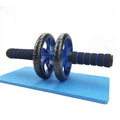 Blue dual-wheel abdominal roller with ribbed foam handles and black wheels on mat