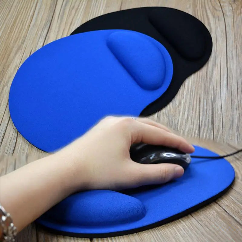 Blue mouse pad with cushioned wrist rest, hand using a black mouse on top