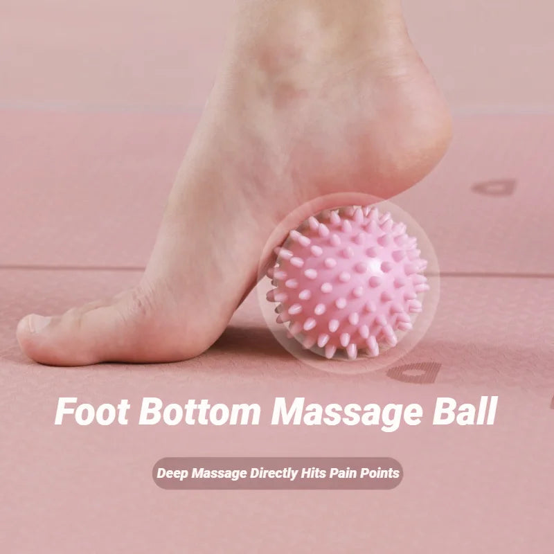 Pink spiky massage ball with small rounded knobs for deep tissue foot pressure