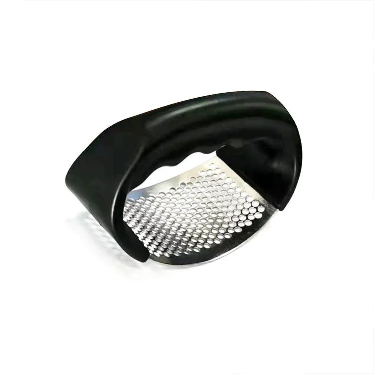 Manual garlic press metal grater insert with black outer frame, angled view