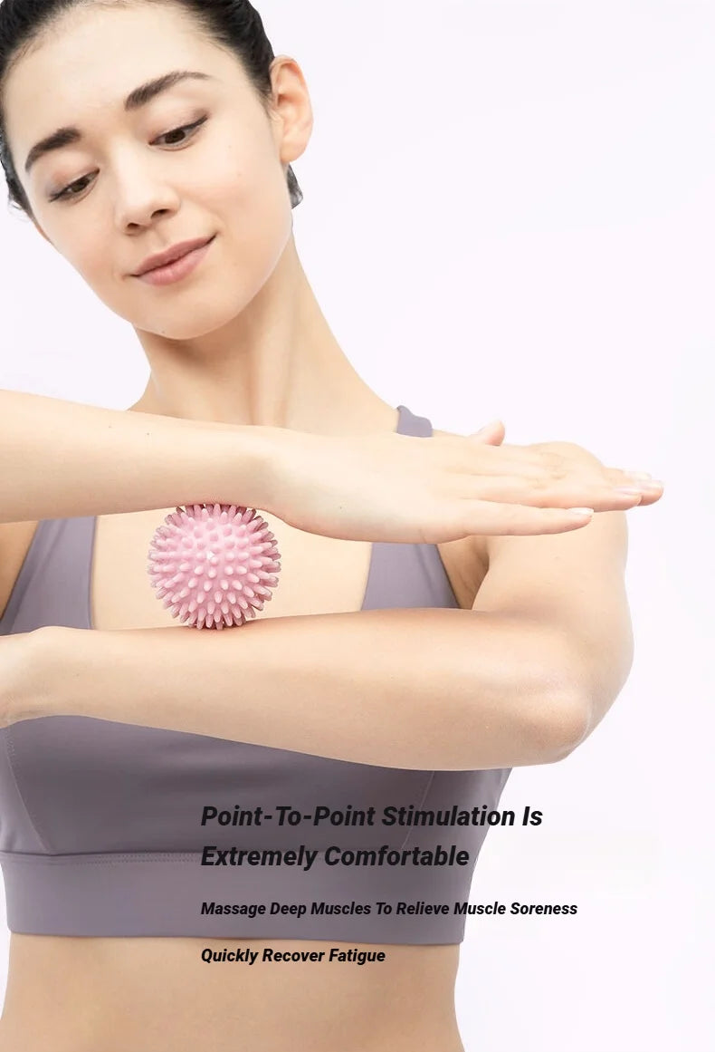 Pink spiky massage ball for deep tissue trigger point muscle recovery