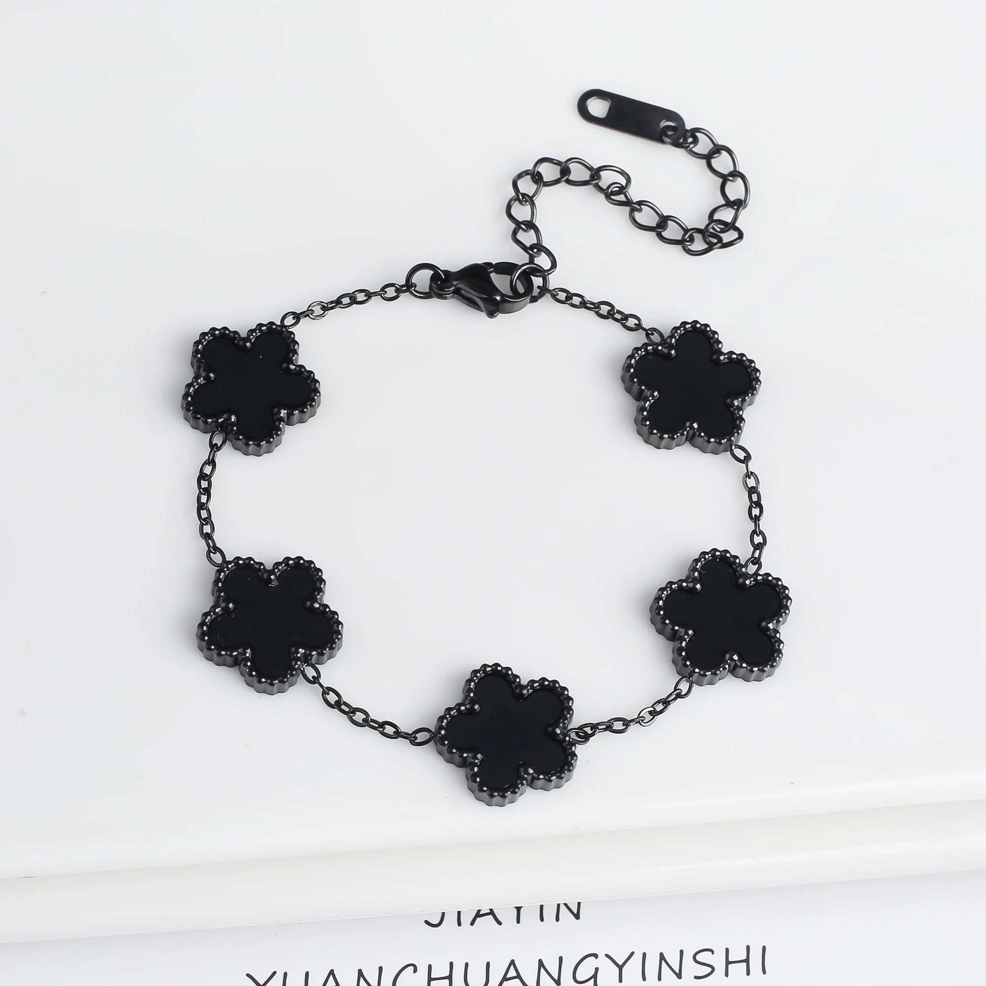 Adjustable black clover flower bracelet with five charms and chain links