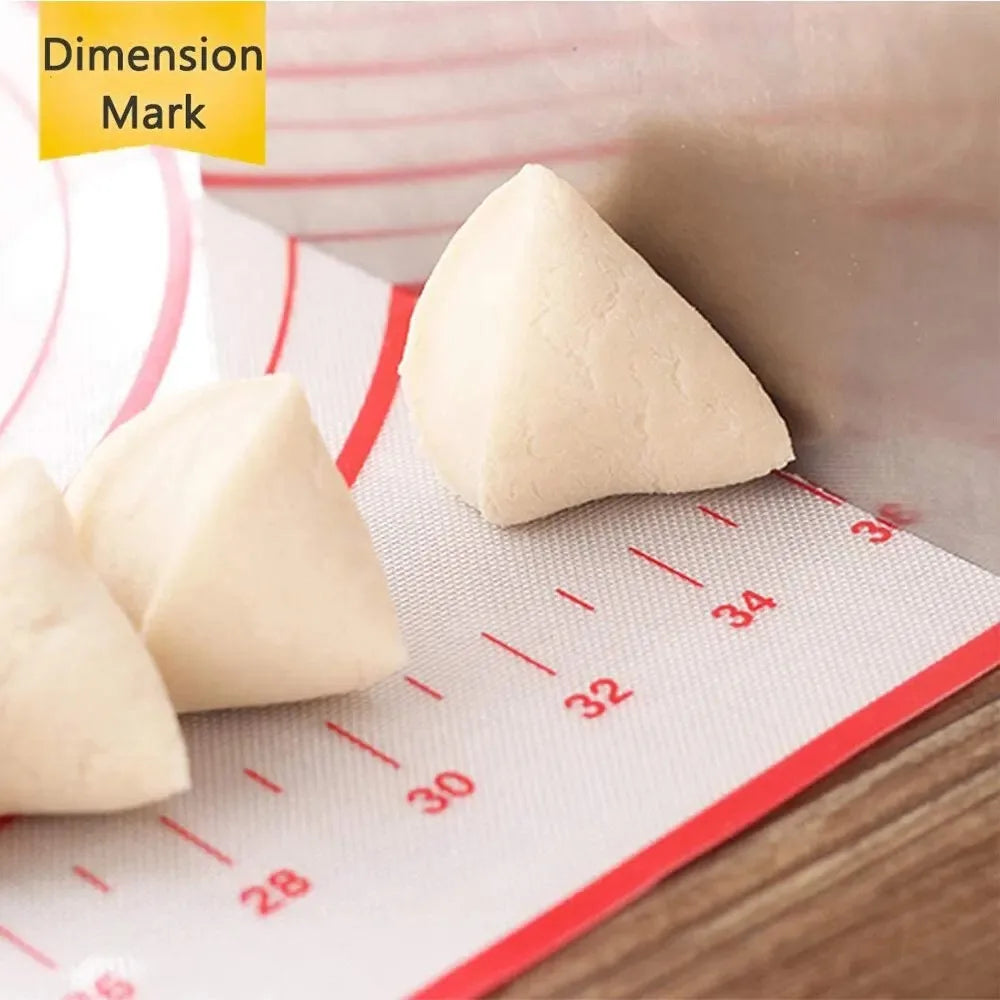 Silicone baking mat with red measurement numbers and concentric rings, holding dough