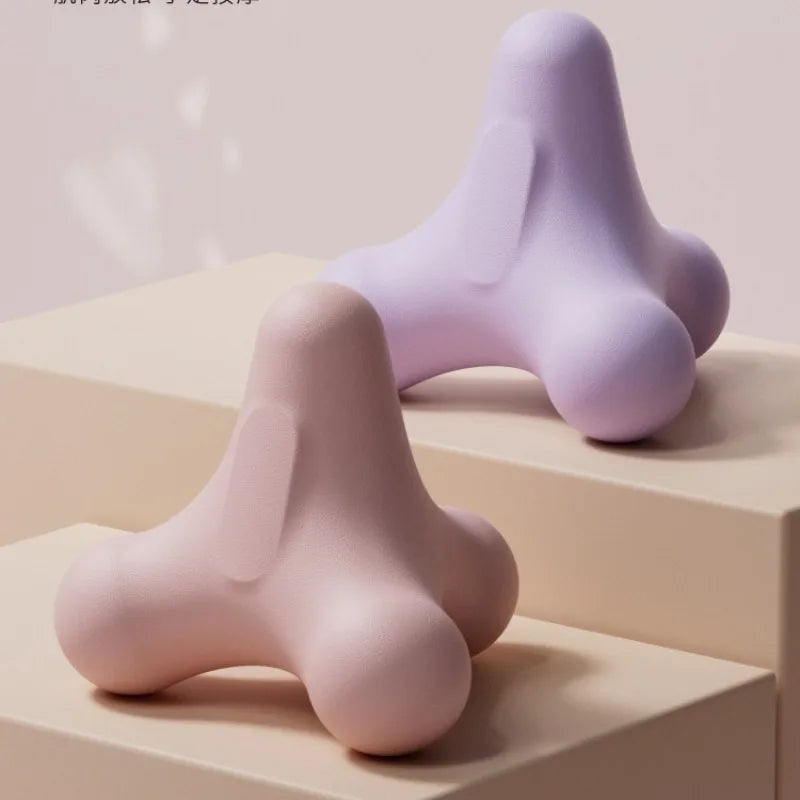 Purple massage fascia ball under foot on a box for calf and foot massage