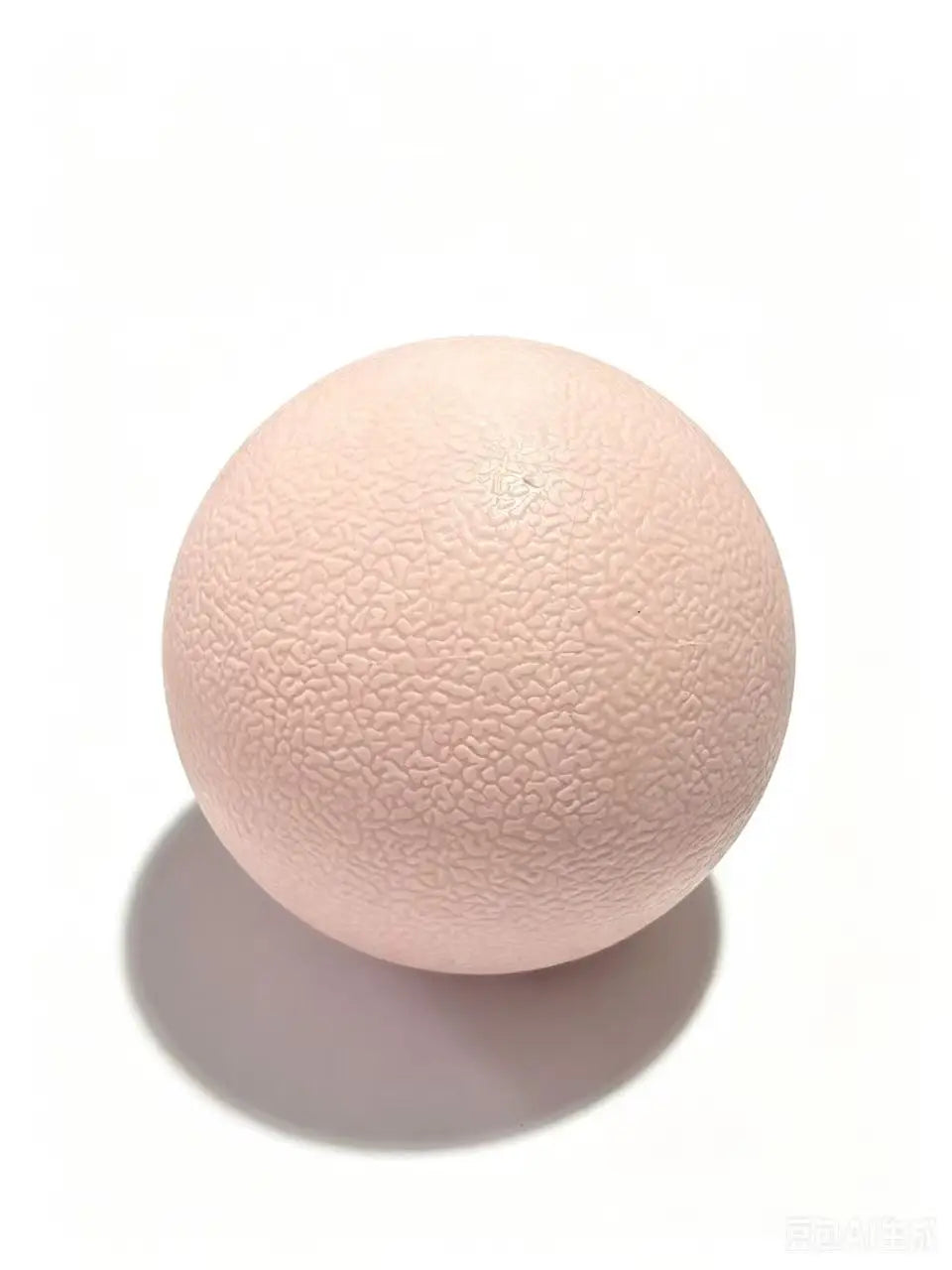 Pink textured massage ball with raised surface dimples