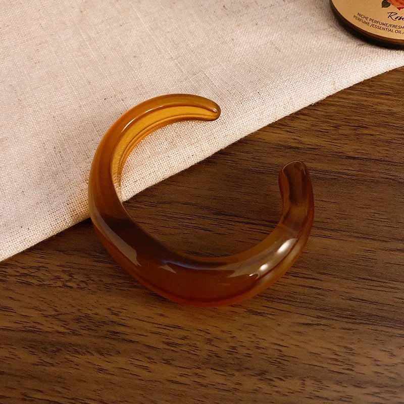 Cognac brown translucent acrylic open bangle with shiny rounded face smudge design