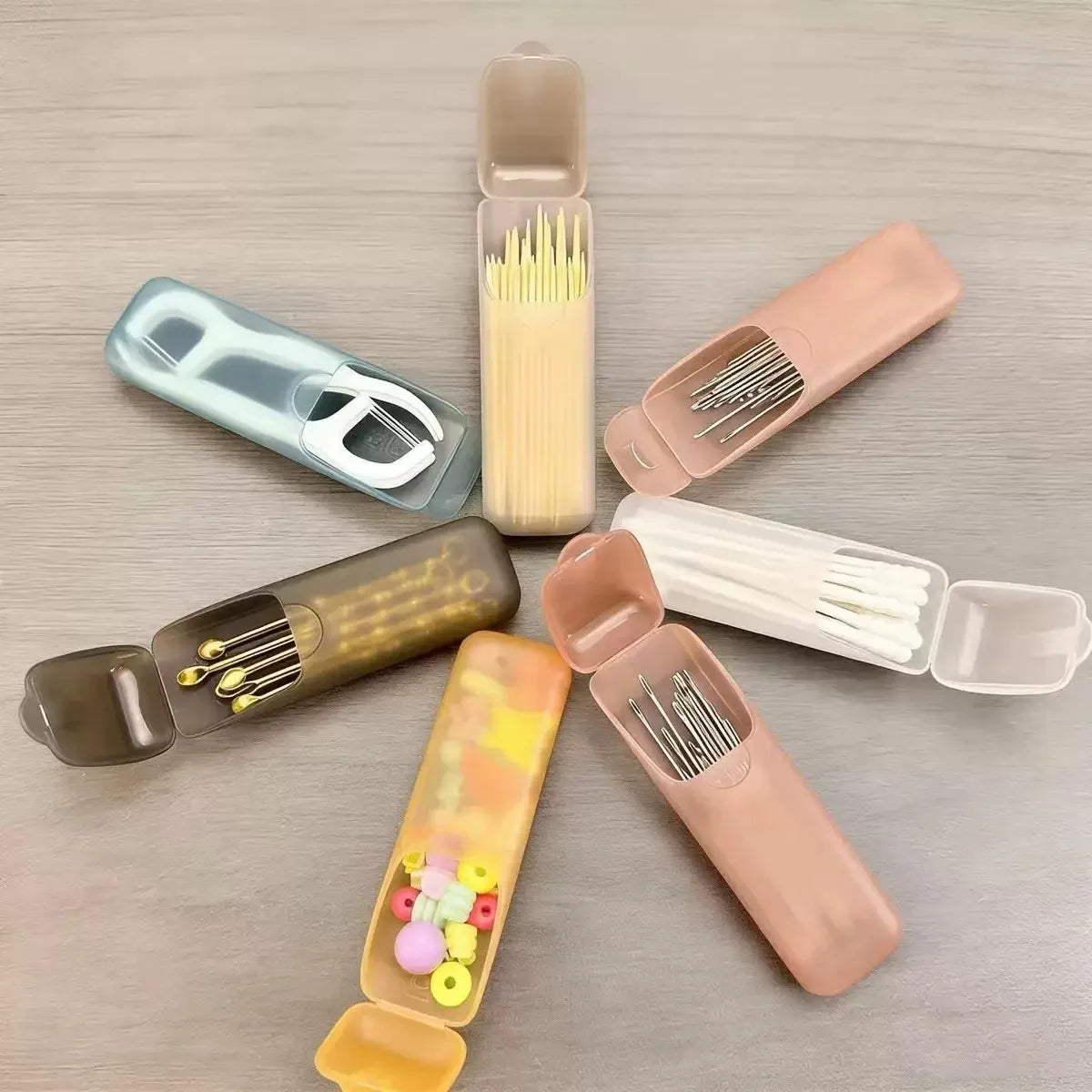 Mini portable storage box cases with snap lids, showing toothpicks and cotton swabs inside