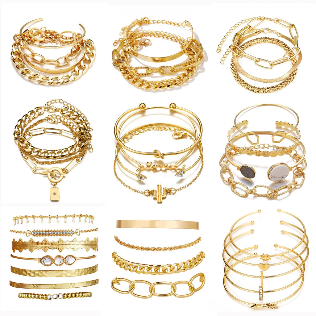 Gold open bangle and chain bracelet set with layered links and small charm details
