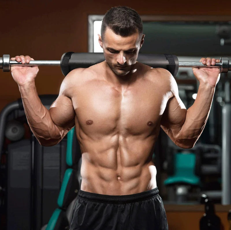 Black foam bar pad on a loaded barbell for shoulder support during squats