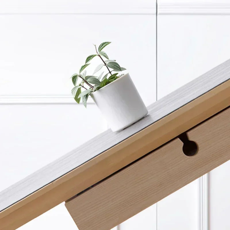 Double-sided adhesive tape strips on wall for temporary poster mounting