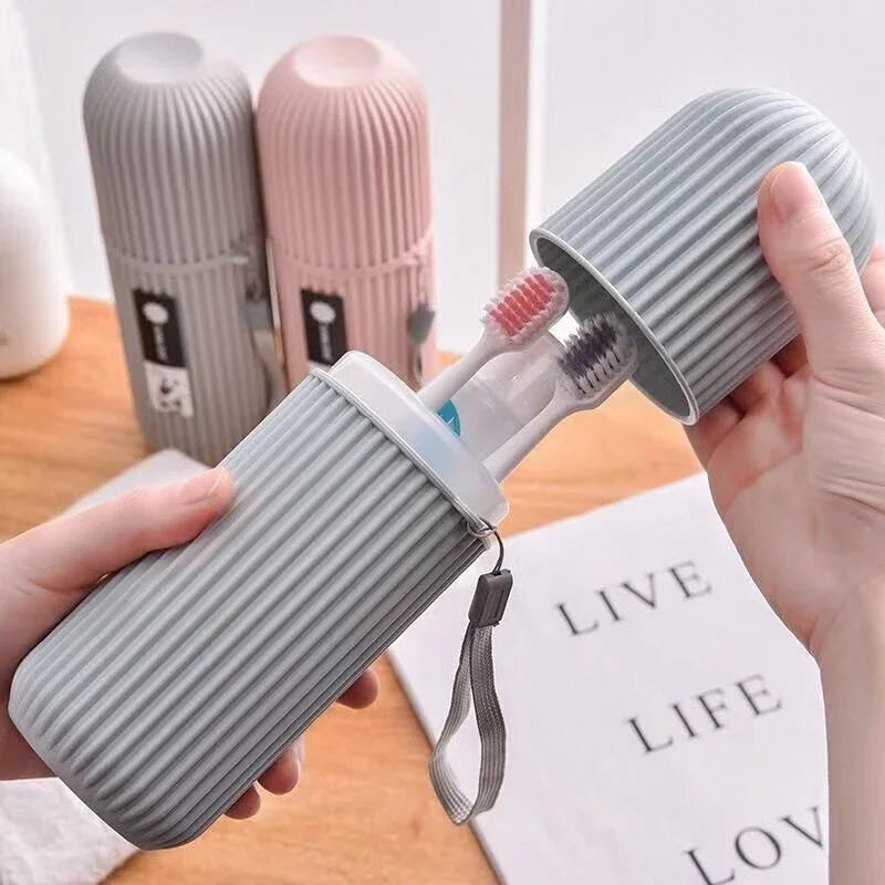 Gray ribbed travel toothbrush holder with open lid and strap
