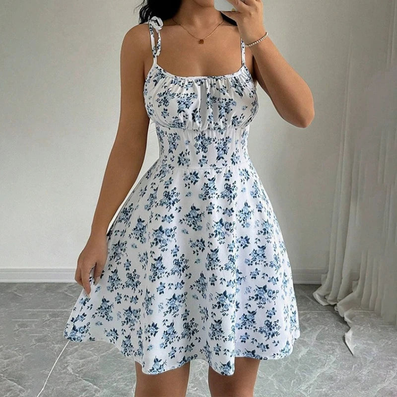 Blue floral spaghetti-strap mini dress with ruched bodice and flared skirt